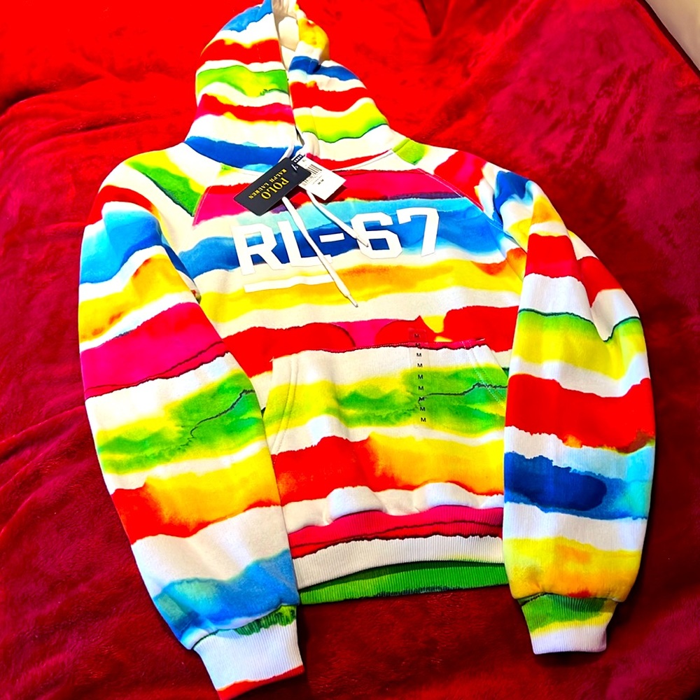Multi colored hoodie/sweater/ sweatshirt with front pockets. Fits for comfort.